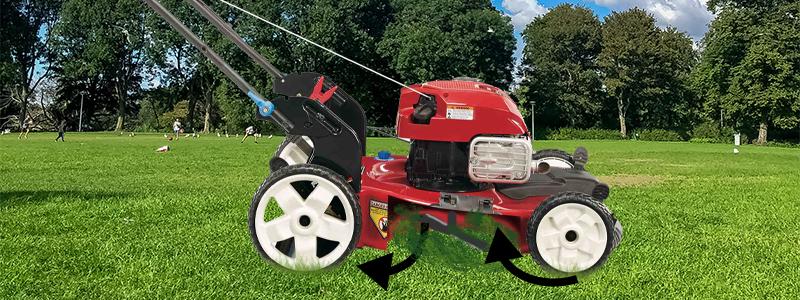 A diagram showing the mulching process. The inside housing of the mower is shown as well as arrows pointing in and back out of the housing.